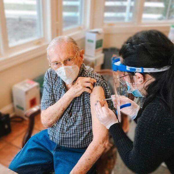Older man getting vaccinated