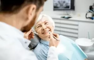 a woman getting her teeth cleaned