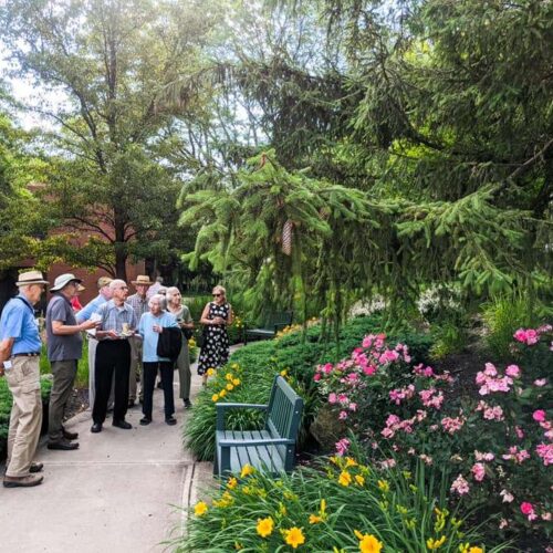 people enjoying the plants in the arboretum